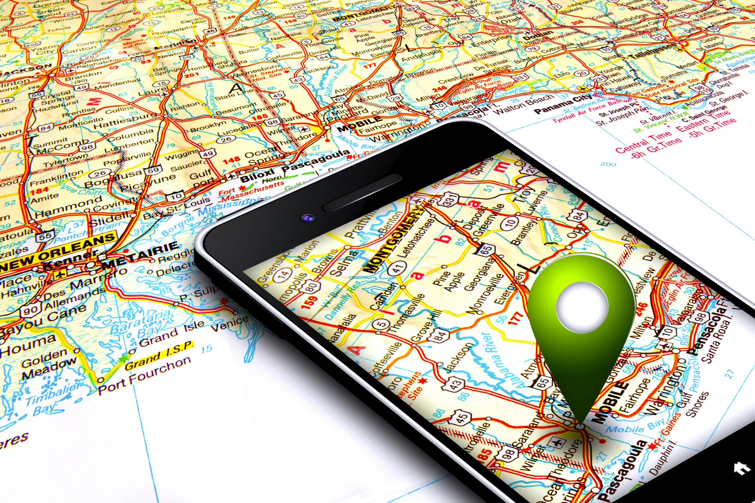 Mobile phone with gps and map in the background