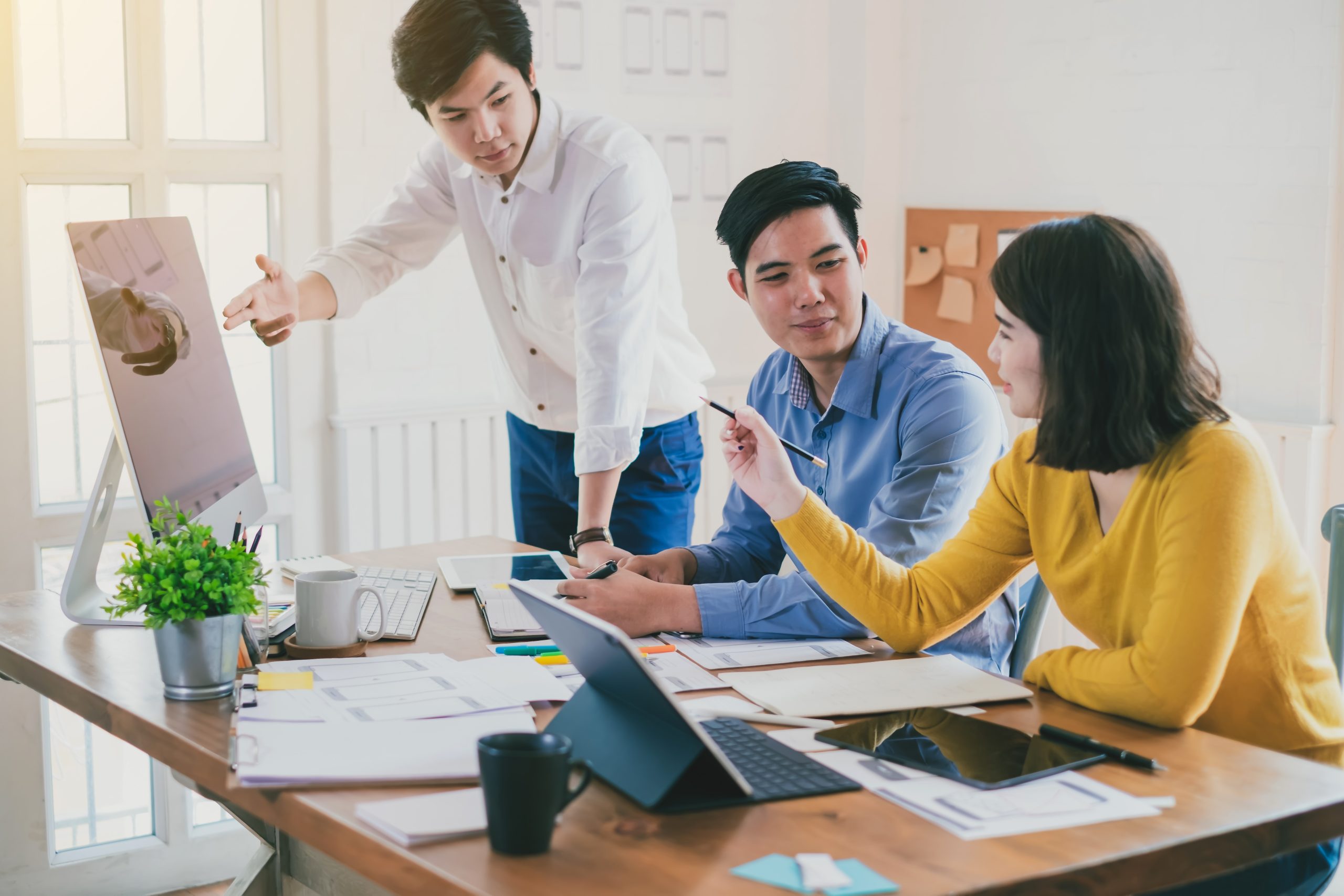 Business persons discussing the importance of having a marketing strategy scaled