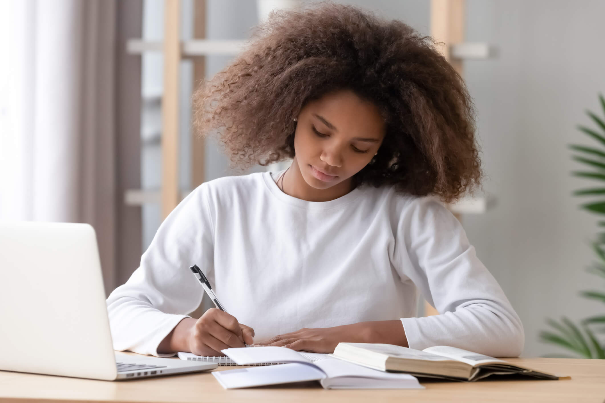 Young woman improving her essays with tips and tools for better writing
